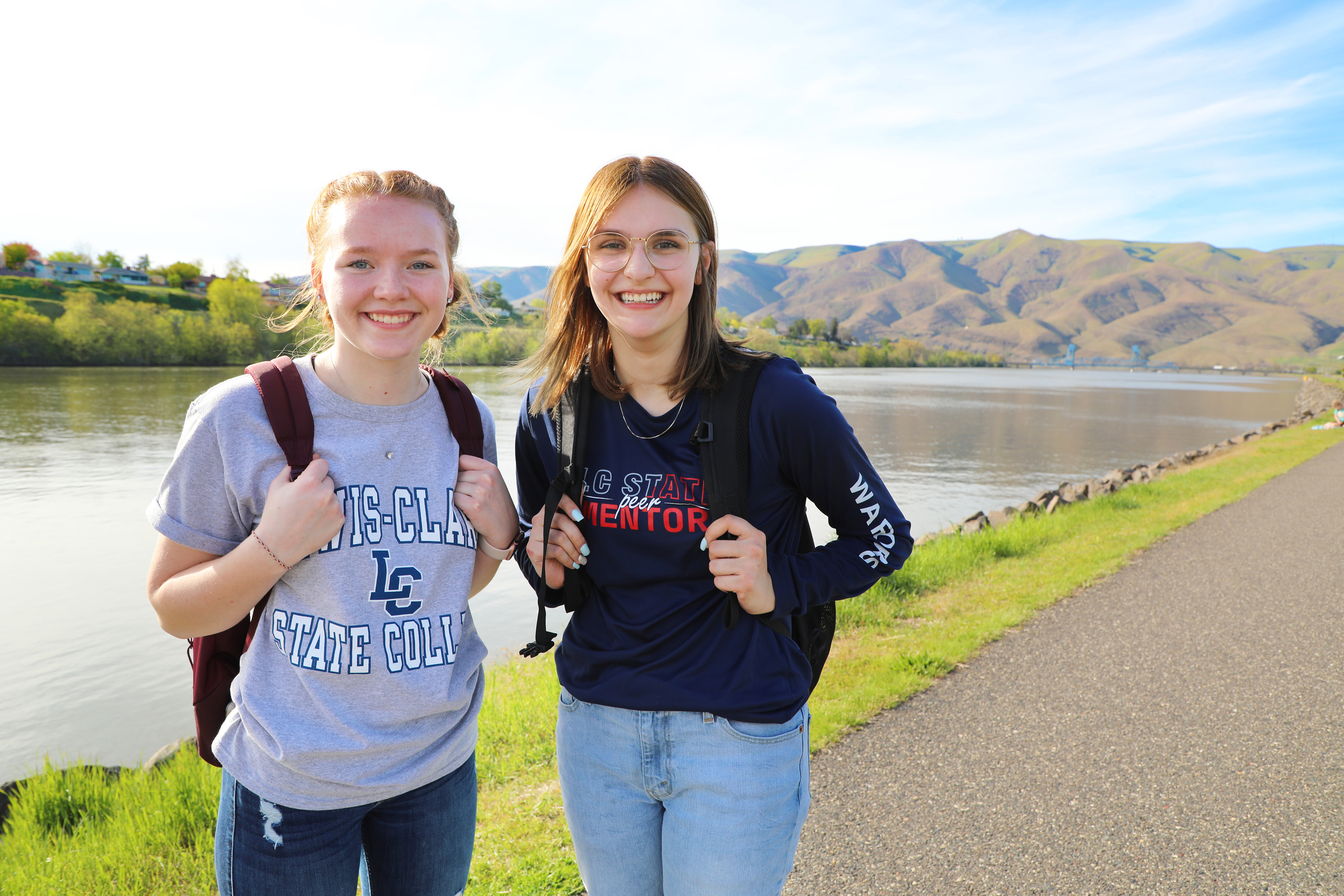 Smiling students standing in front of the snake river