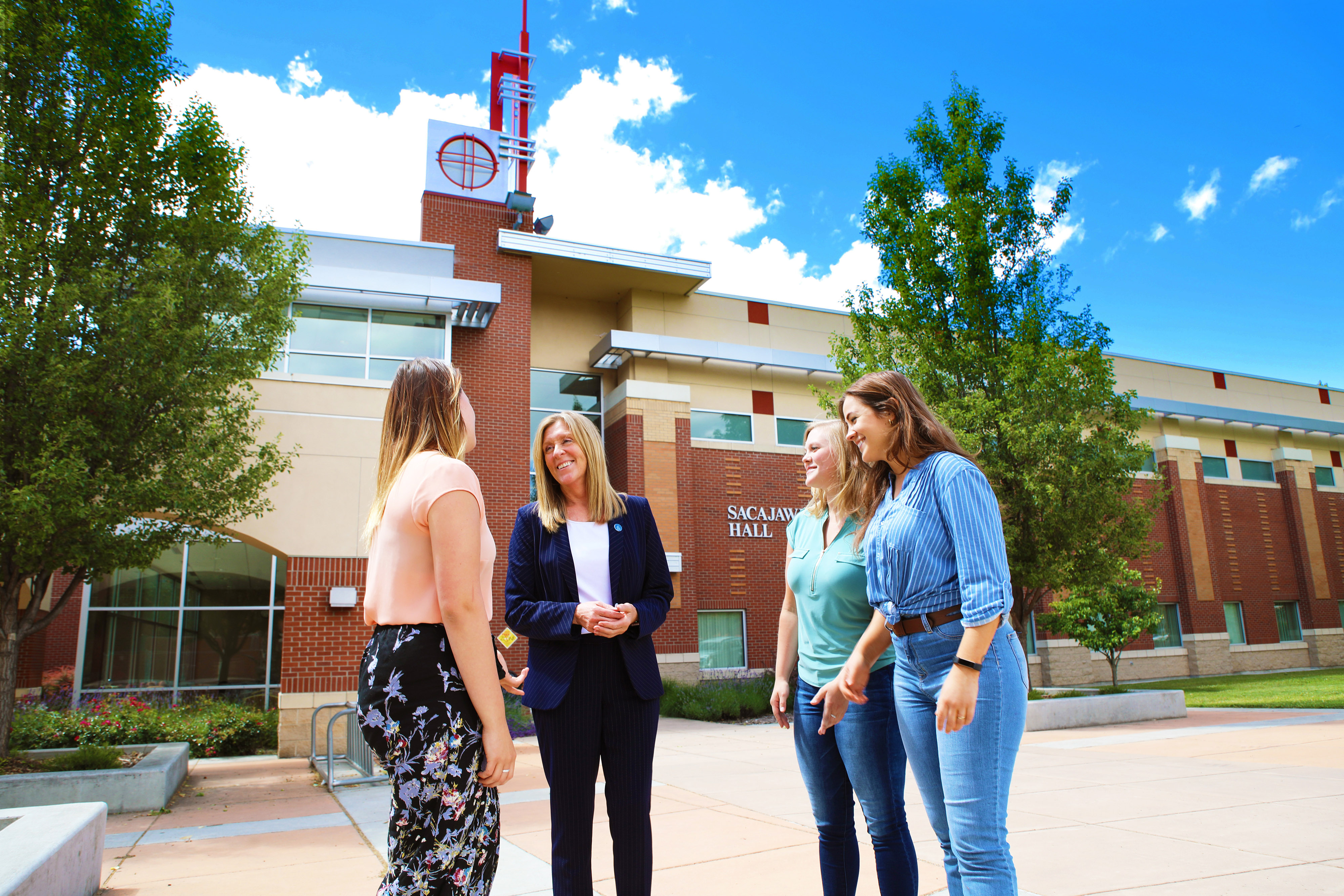 President Cynthia Pemberton talking to students on campus