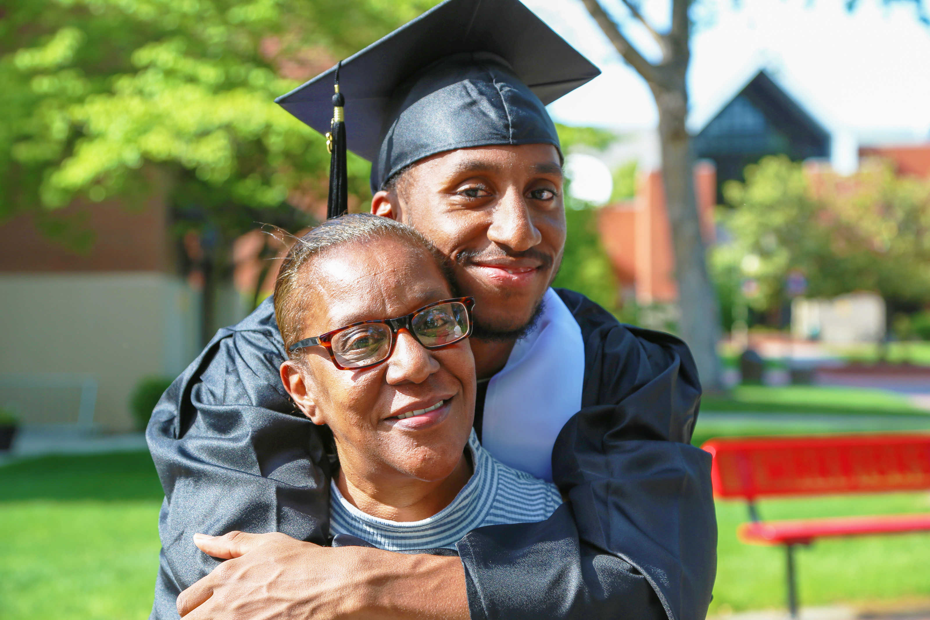 Student with family member at graduation