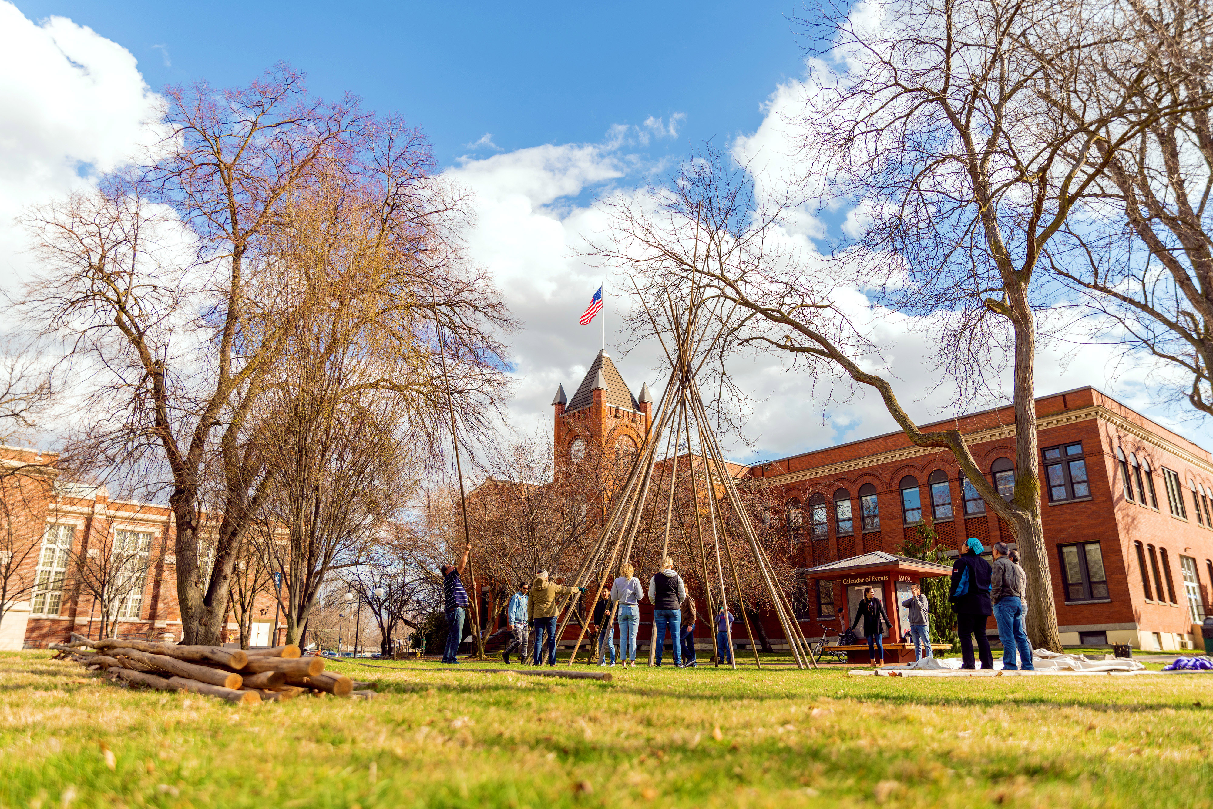 Students setting up tipi on LC State campus