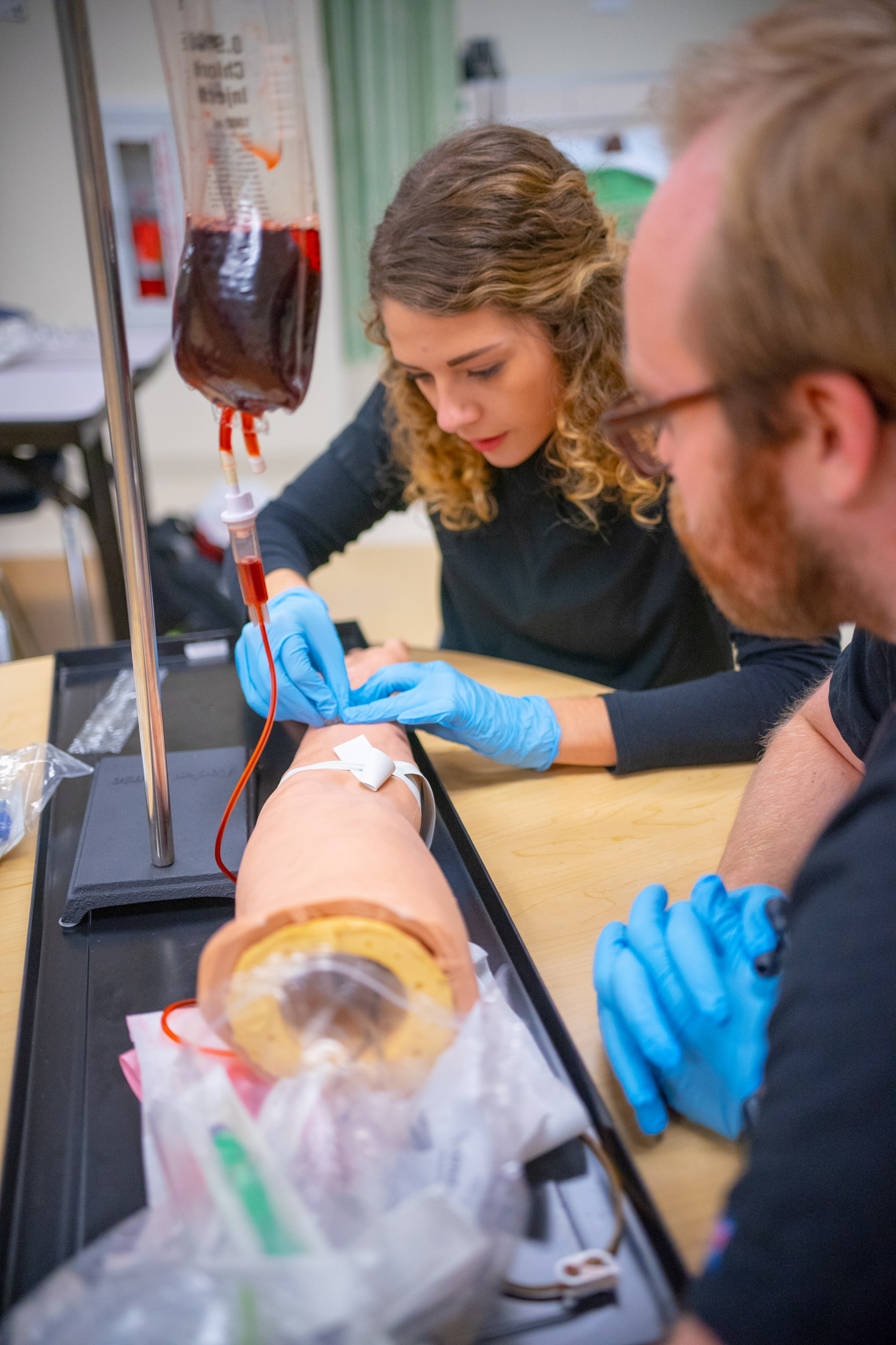Nursing students working on a dummy
