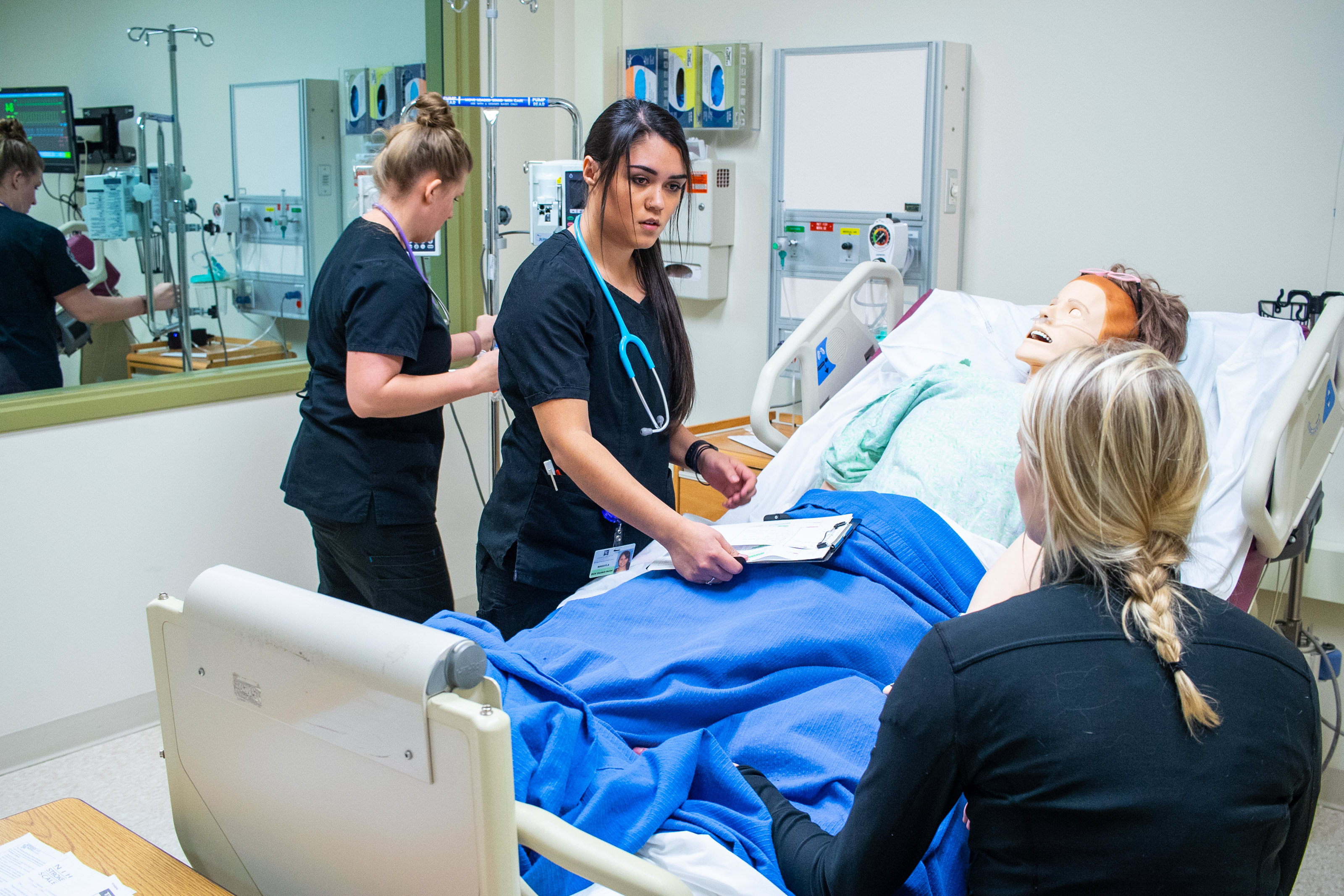 Nursing students working on a dummy