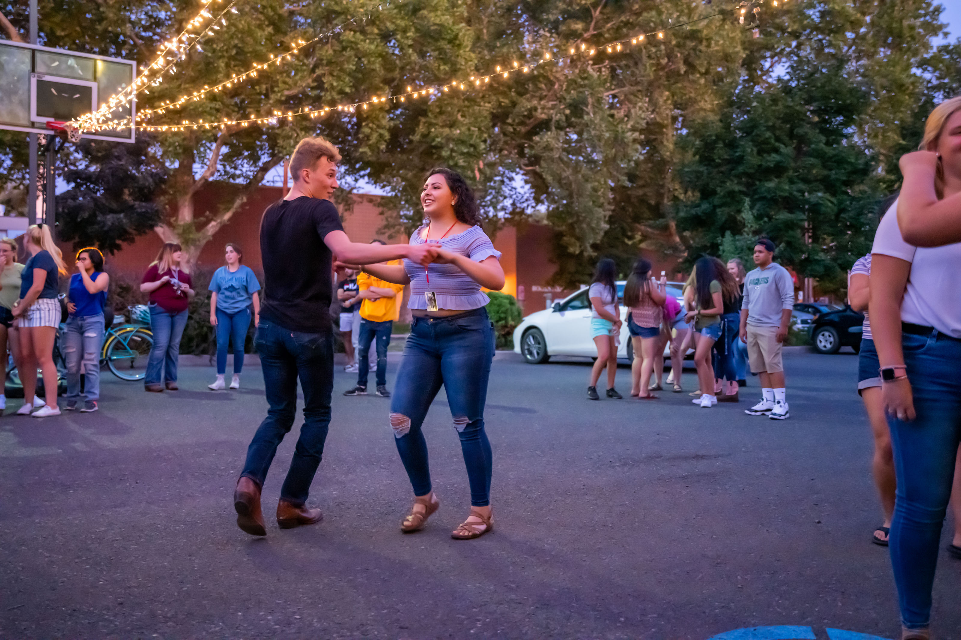 Two students swing dancing outdoors
