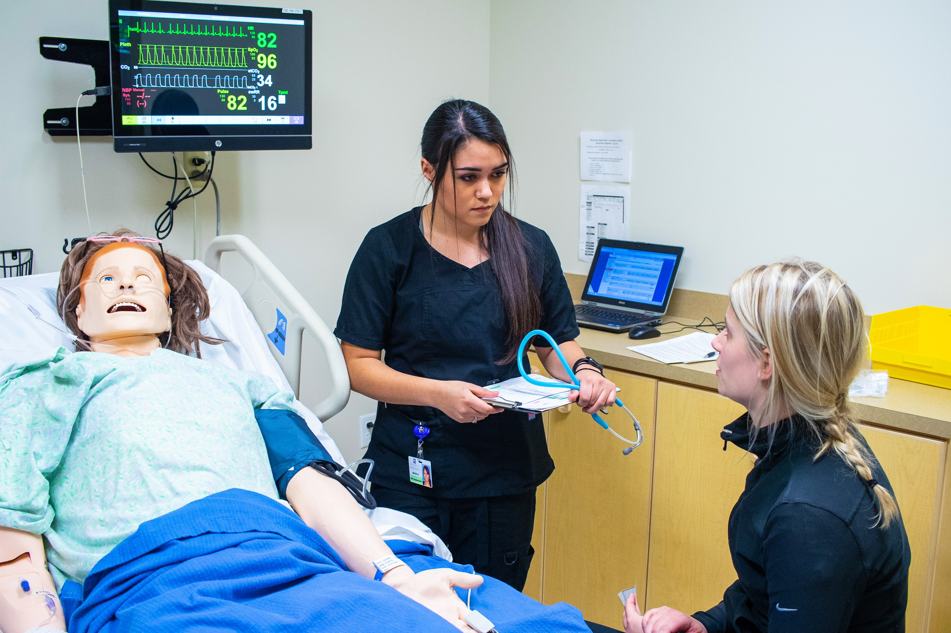 nursing students with dummy
