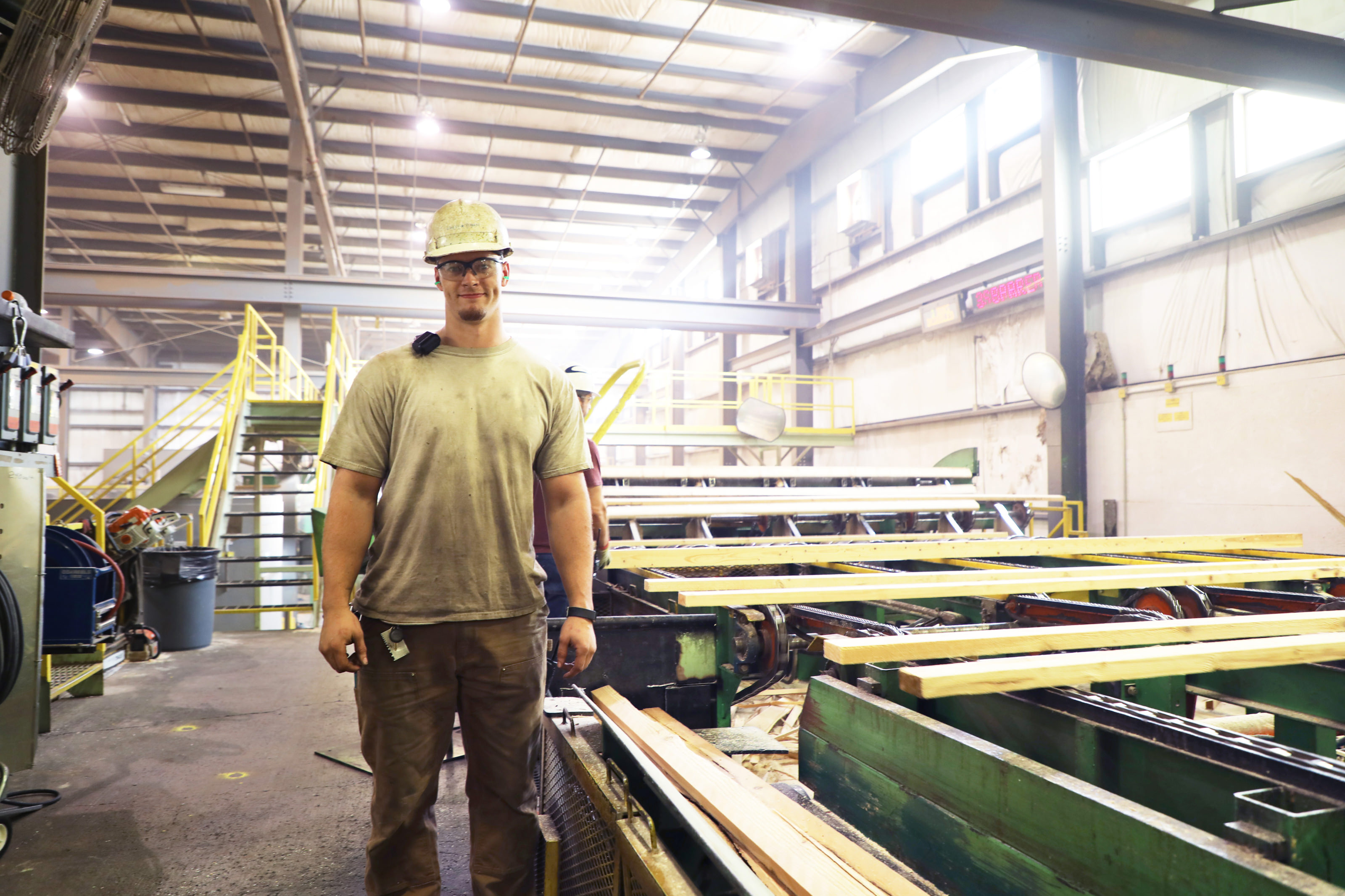 Millwright worker in a large wood processing factory