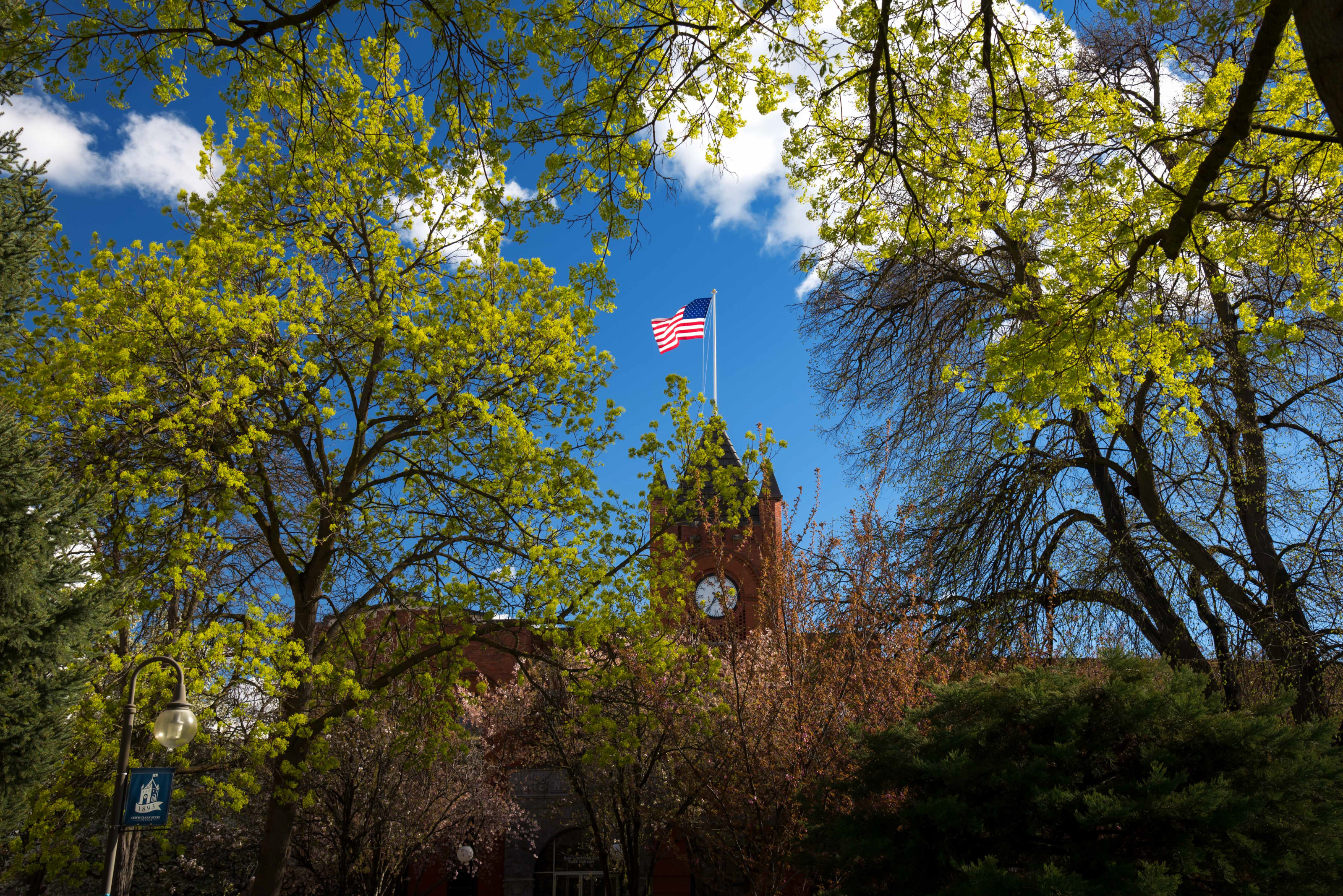 US flag at top of Reid Centennial Hall clock tower