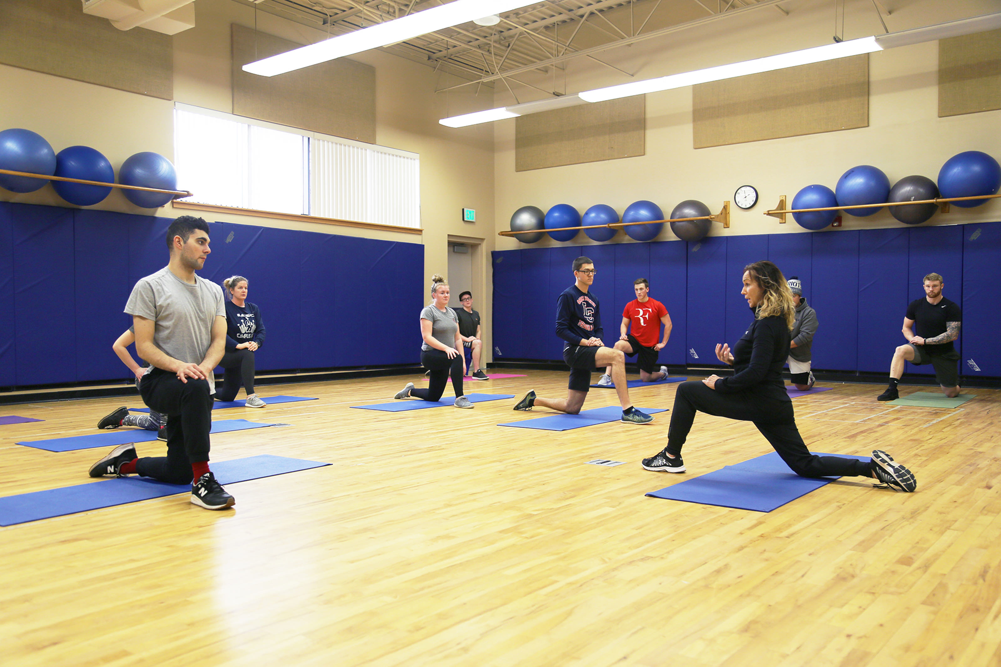 Kinesiology class with students stretching