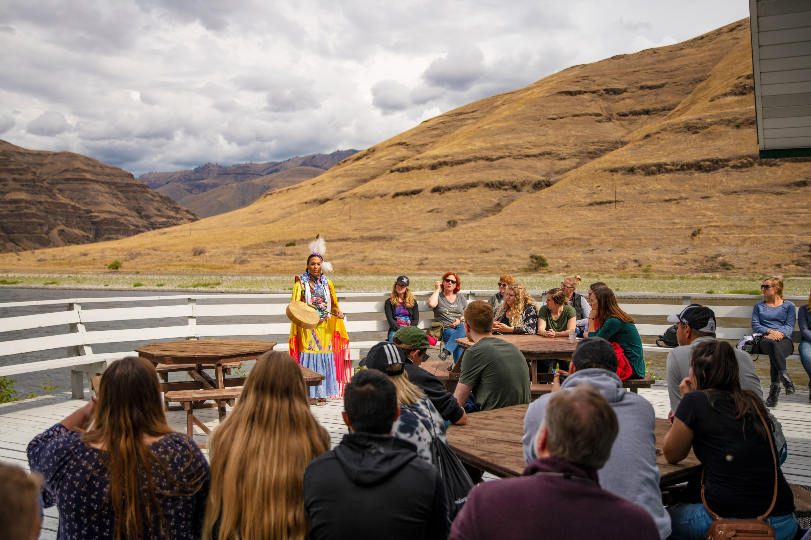 Crowd watching Nez Perce presentation near river