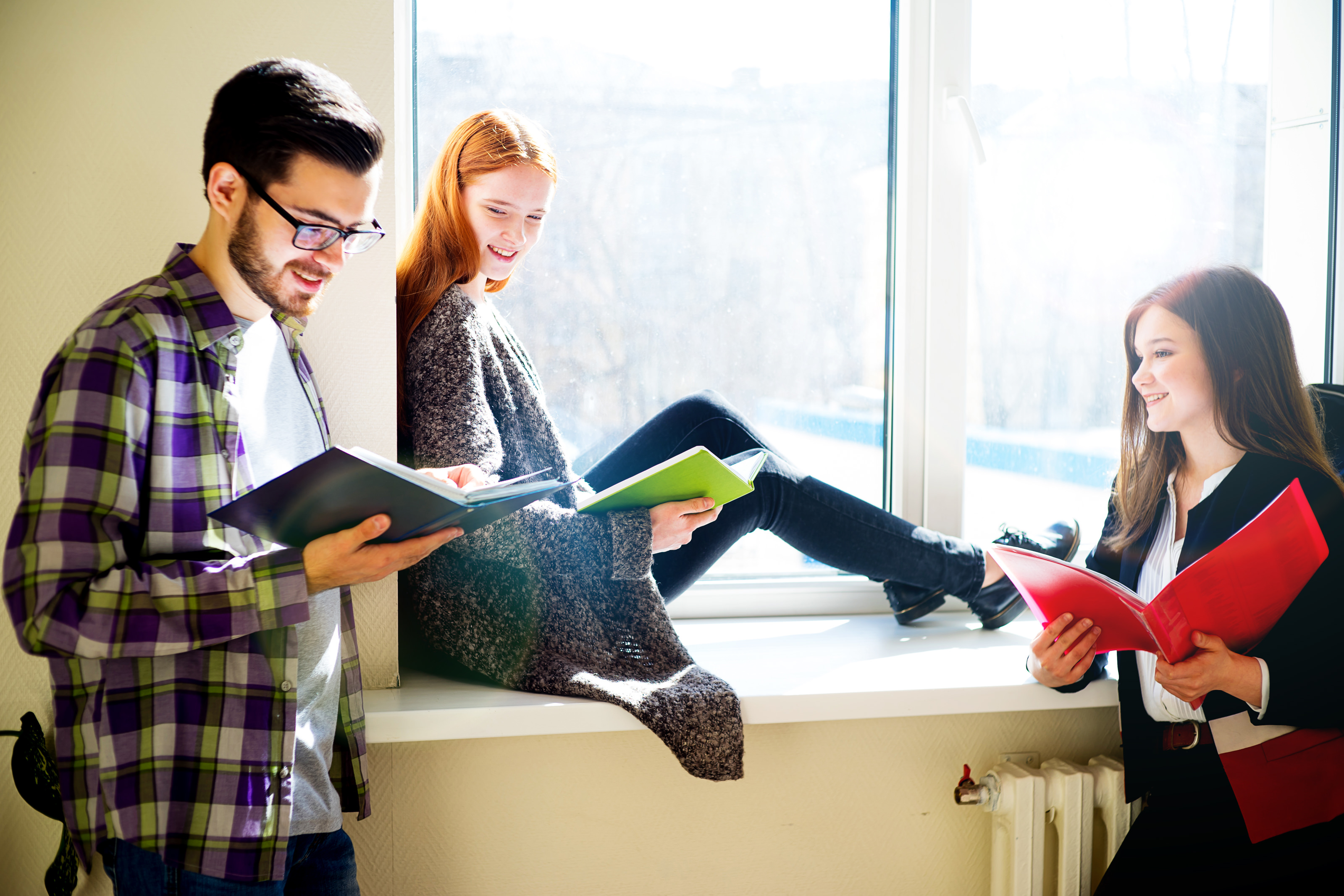 Three students reading together