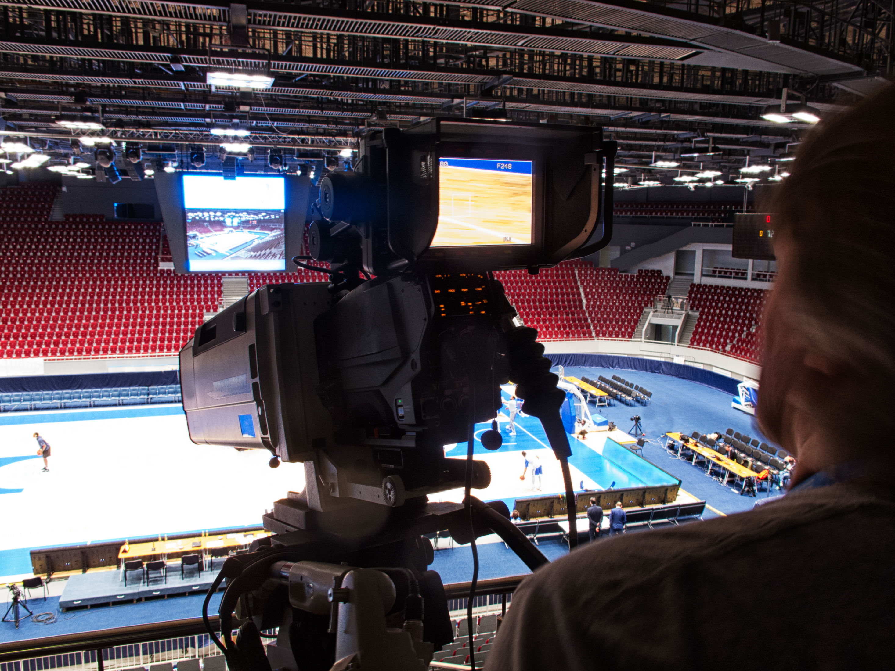 Camera man filming a sporting event