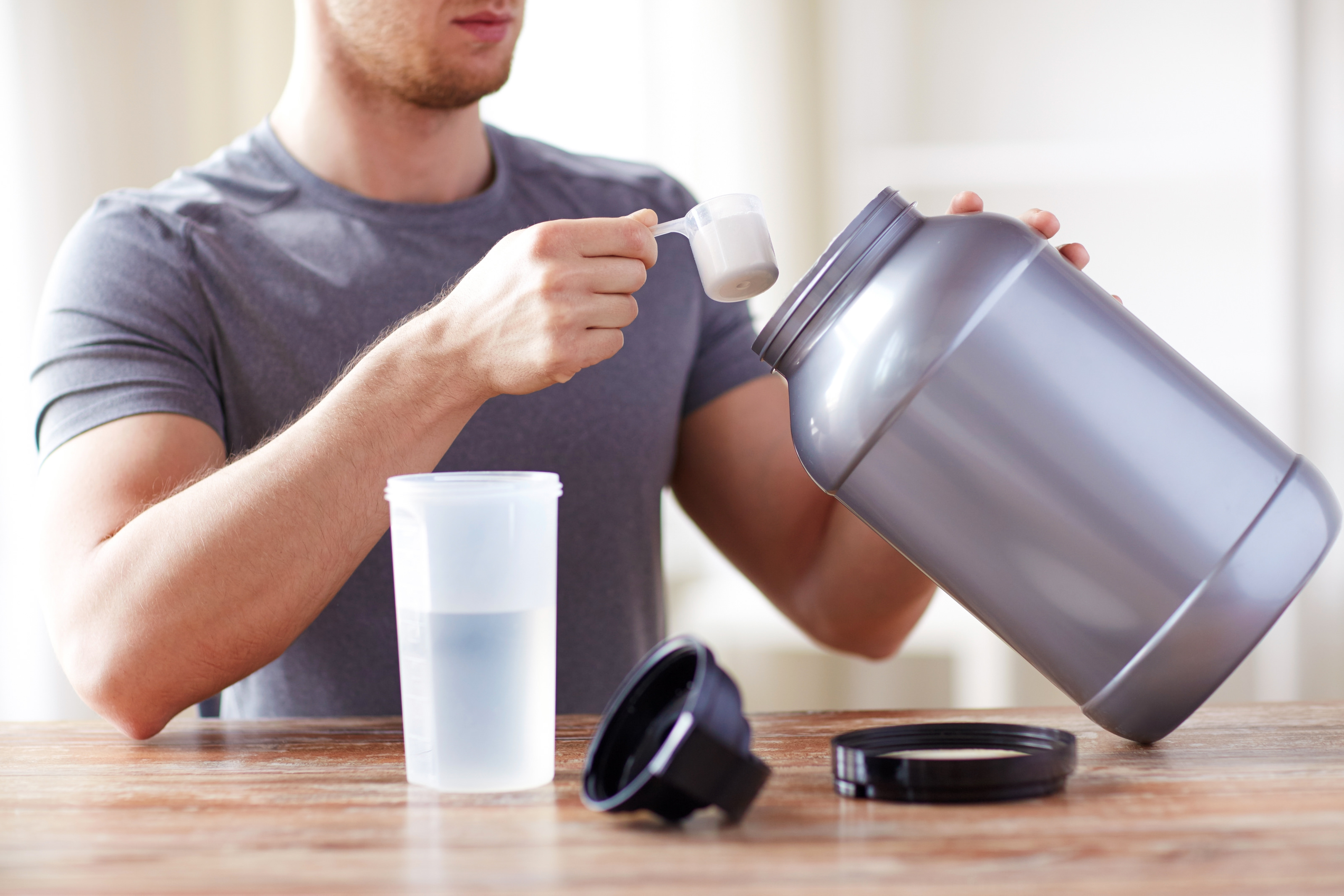 Man mixing water with supplement