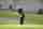 Golfer chipping onto green