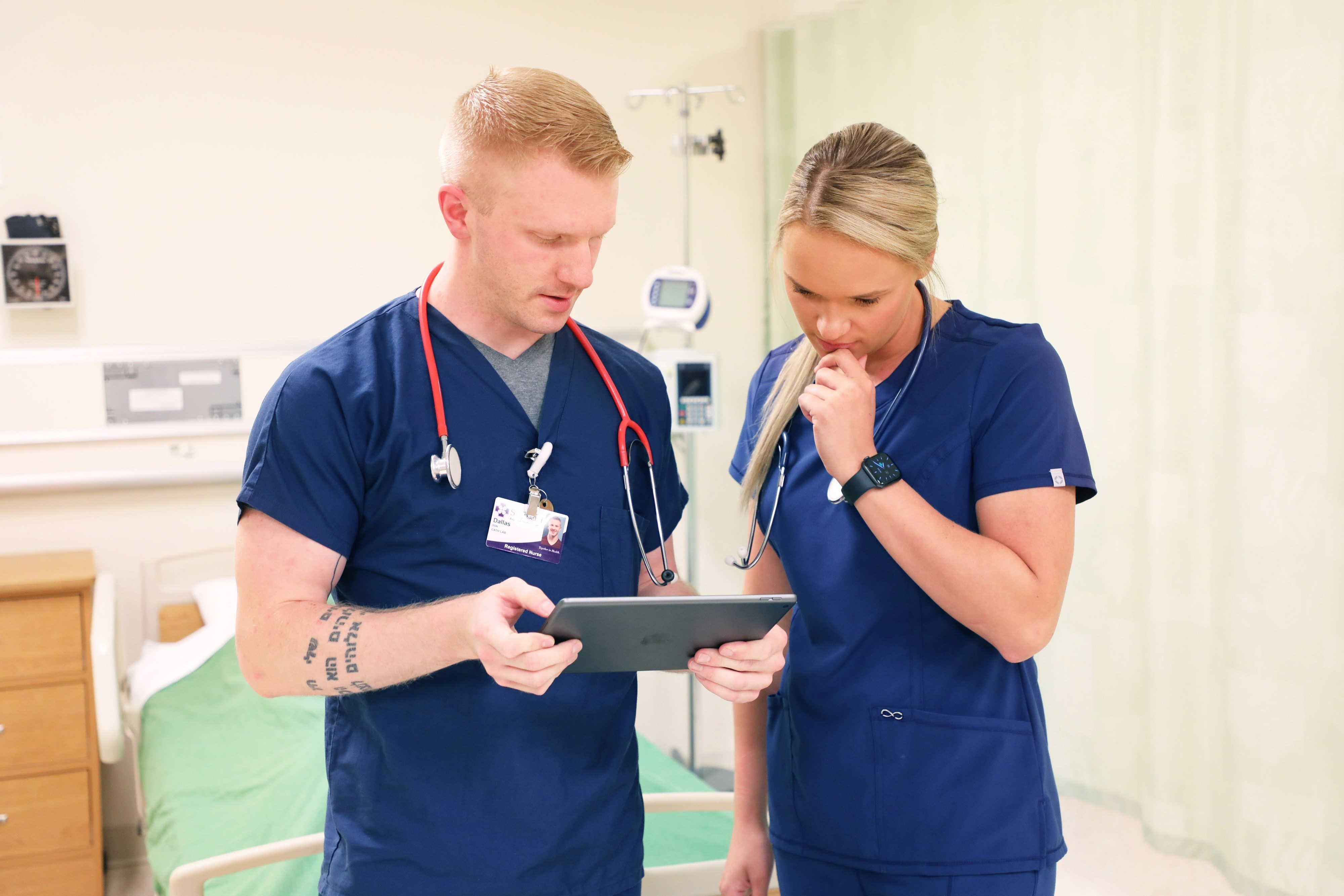 Two LC State nursing students looking at a report