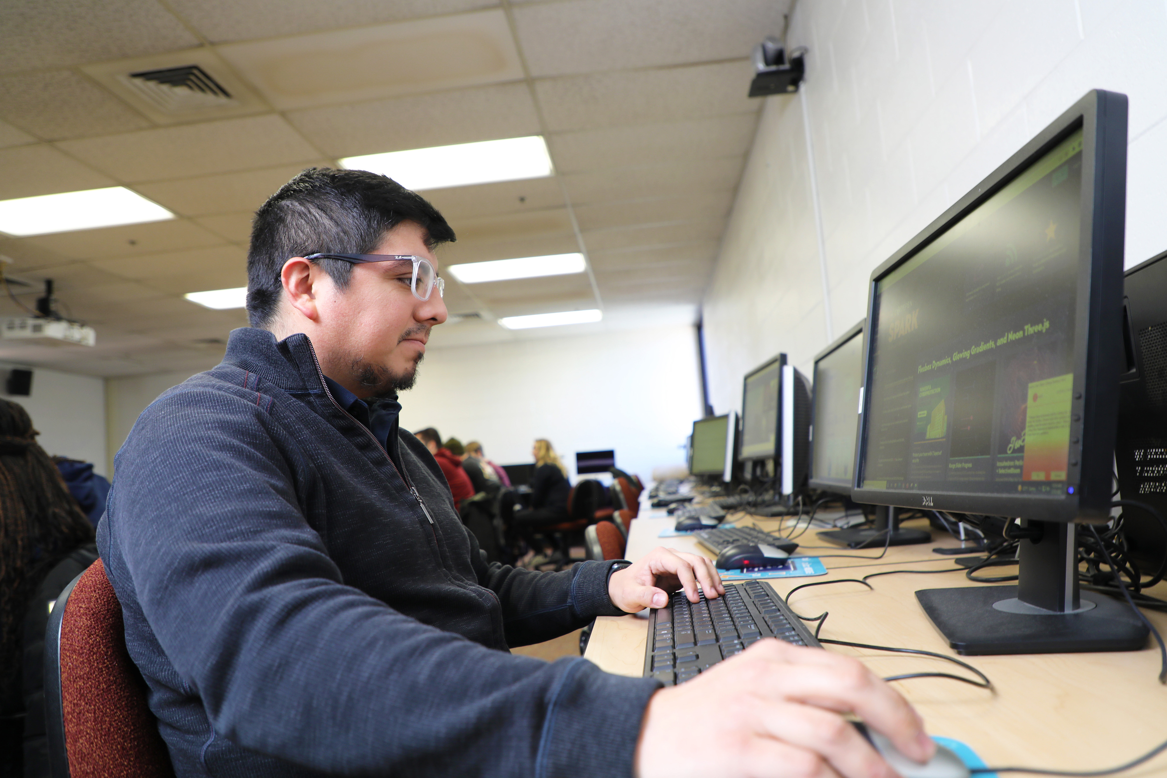 Male student using a computer