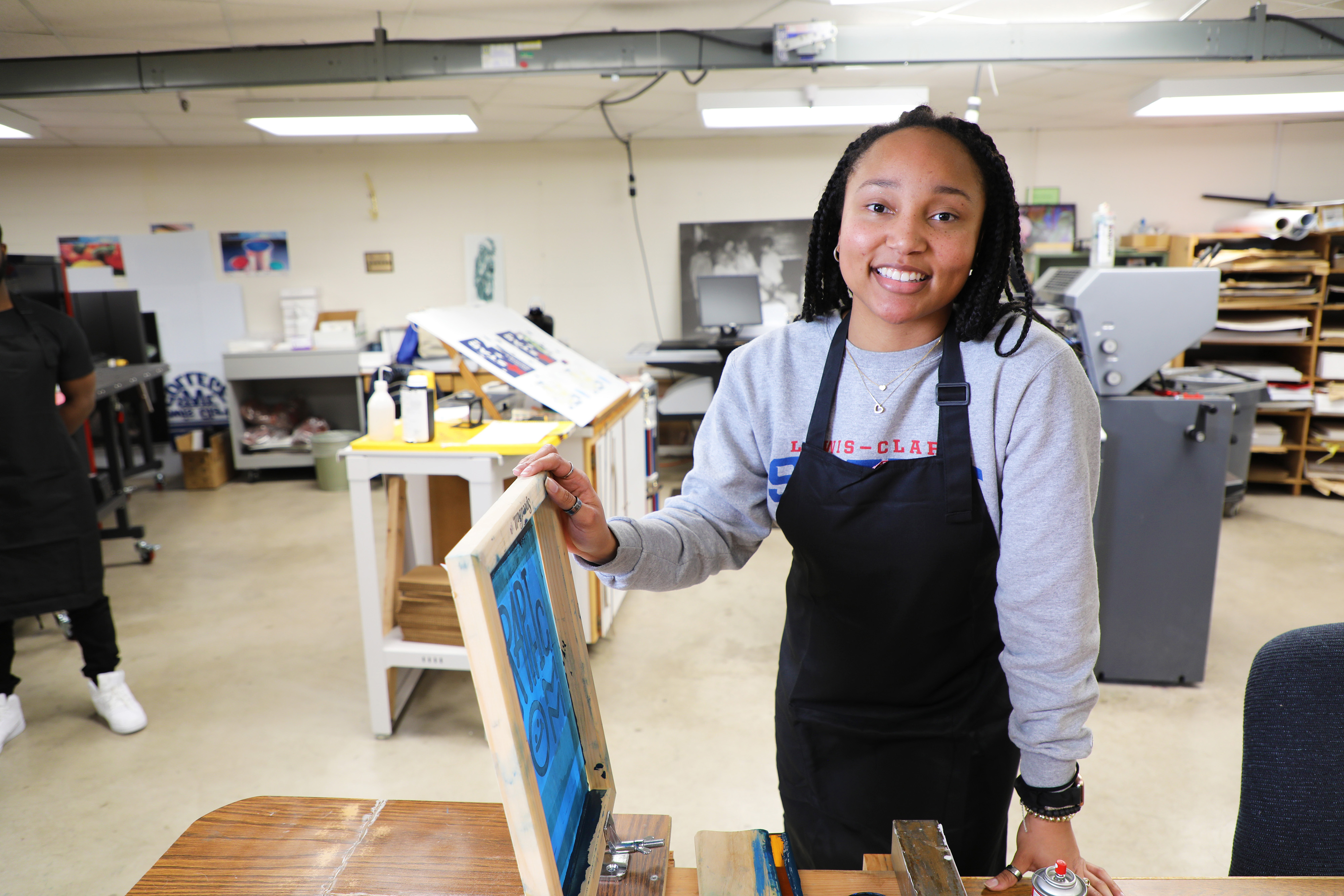 Graphic Communications student in the print shop