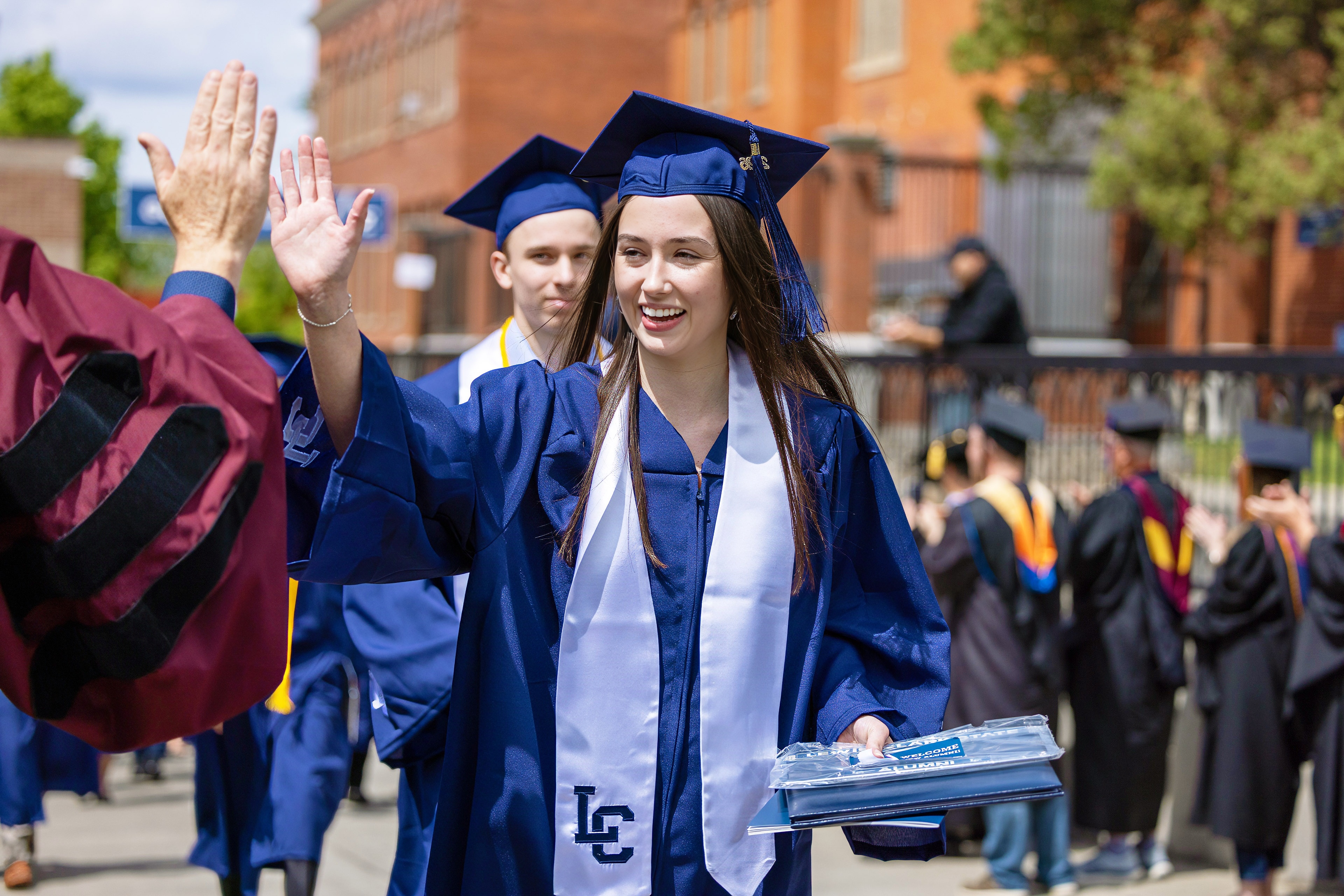 students sitting at graduation
