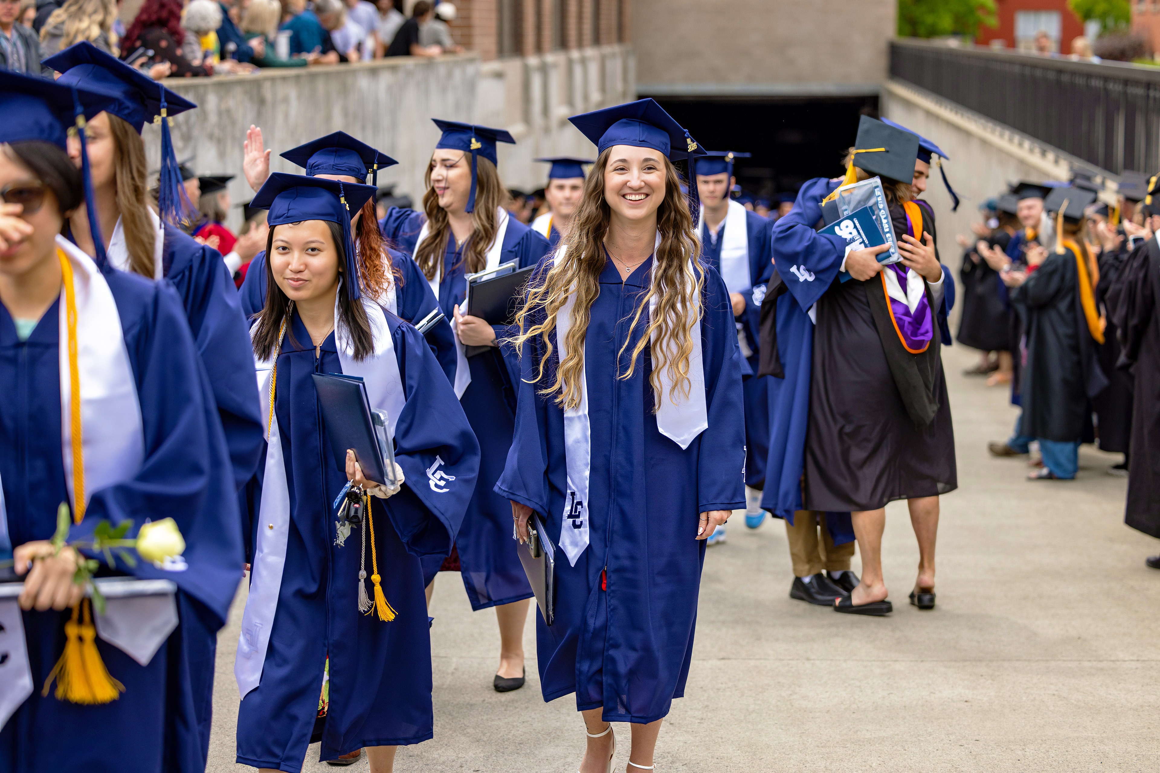 Woman posing as the newest Alumni of LC State